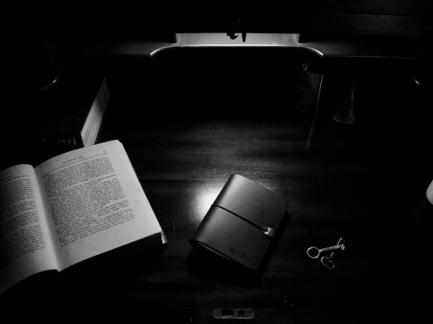notebook and keys on desk