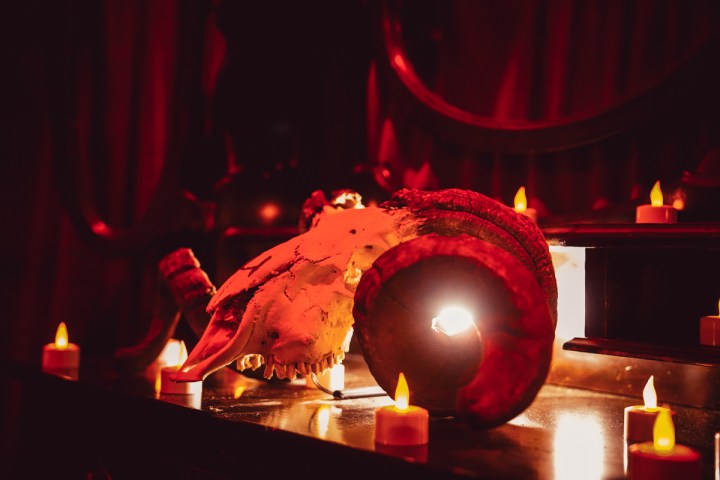 a lit candle on a table