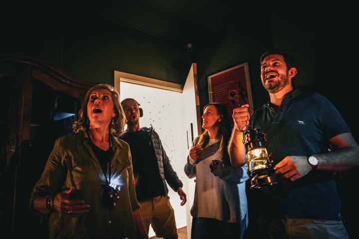 A group of people entering an escape room
