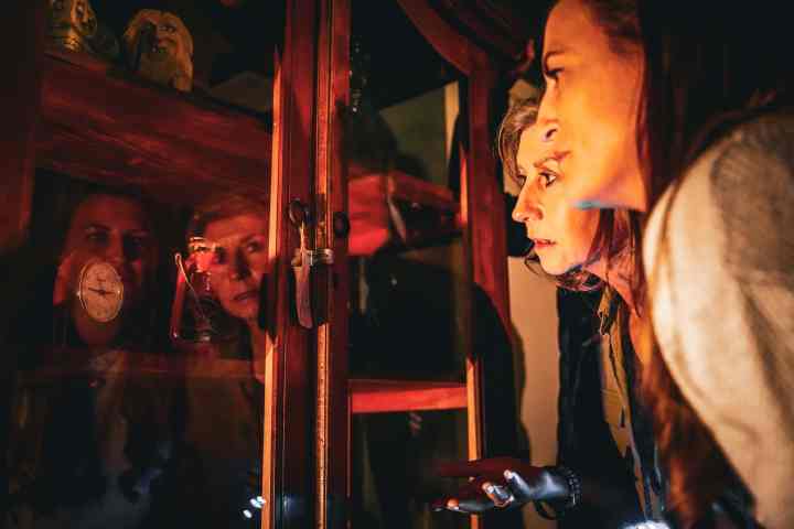 Two women looking at a display cabinet