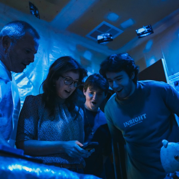 a group of people in a dark room