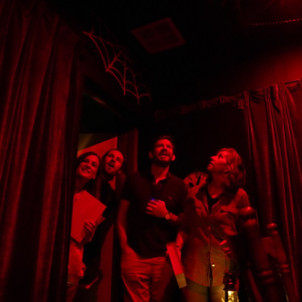 A group of people entering a red room